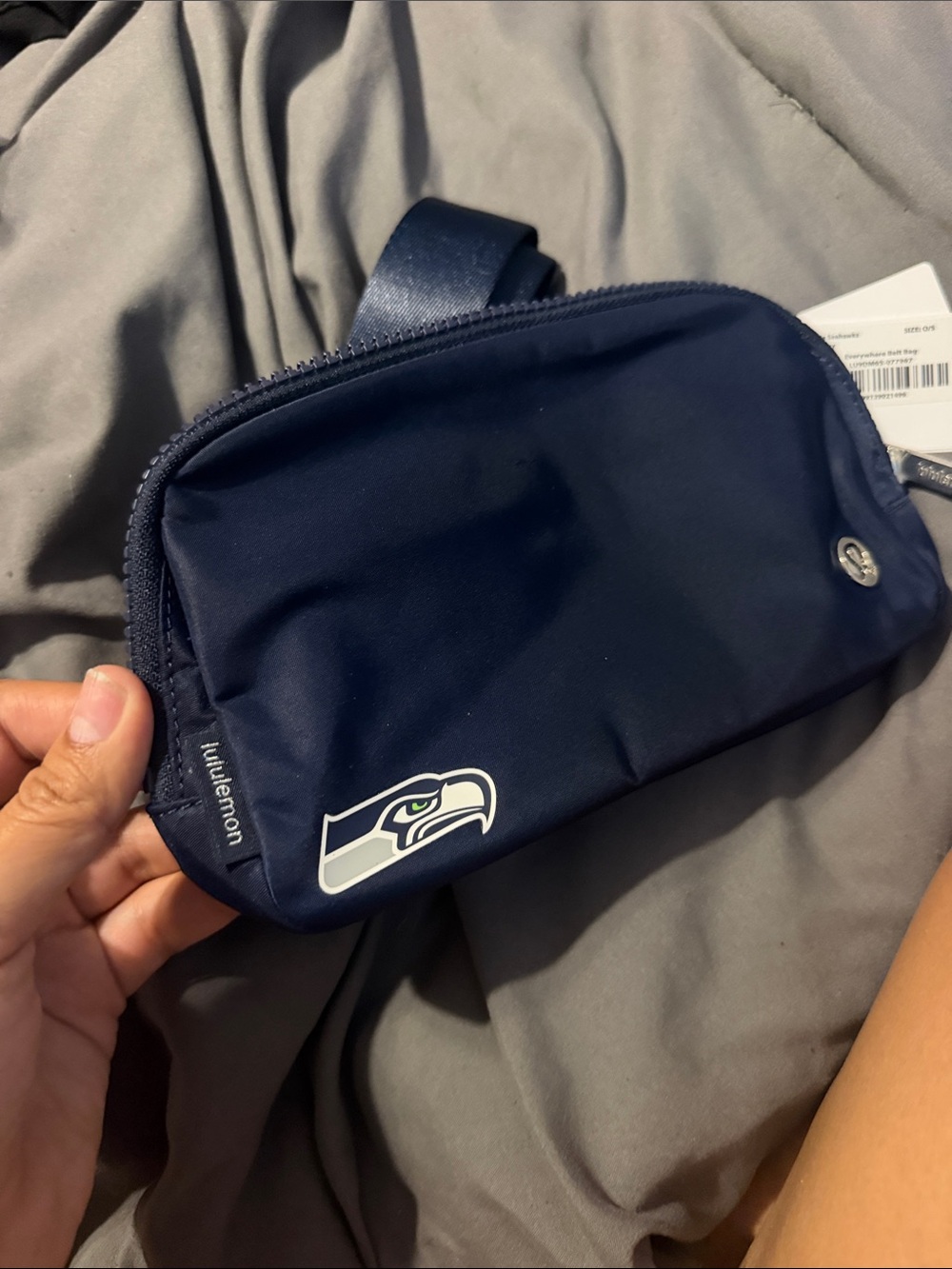 lululemon athletica navy blue sling belt bag with Seattle Seahawks patch